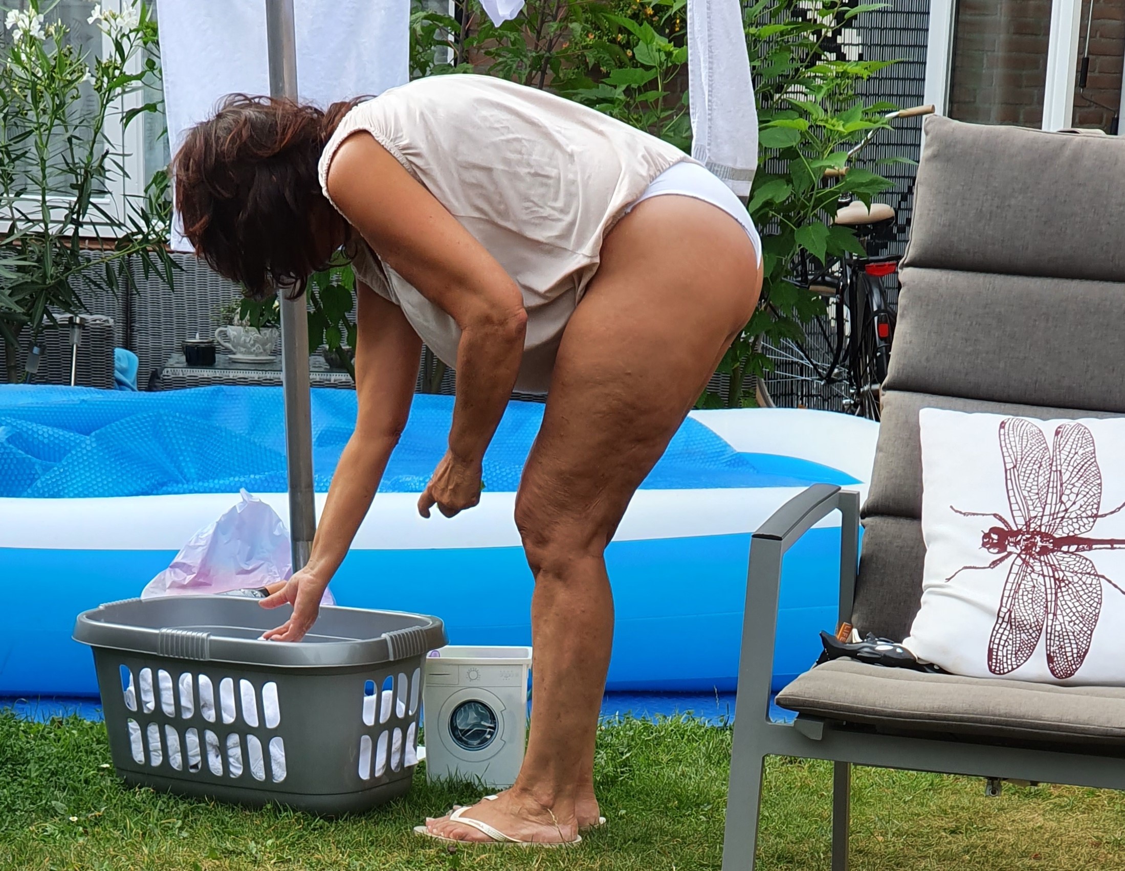 Voyeur wife doing laundry in white panties