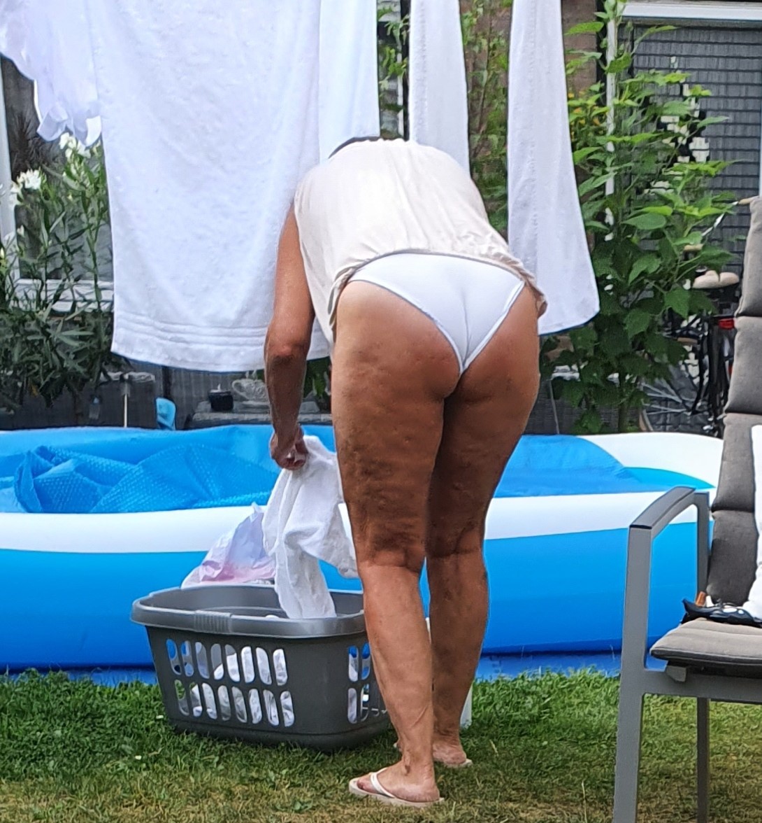 Voyeur wife doing laundry in white panties pic