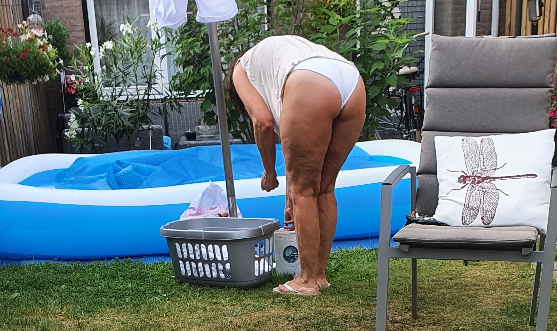 Voyeur wife doing laundry in white panties Immagine