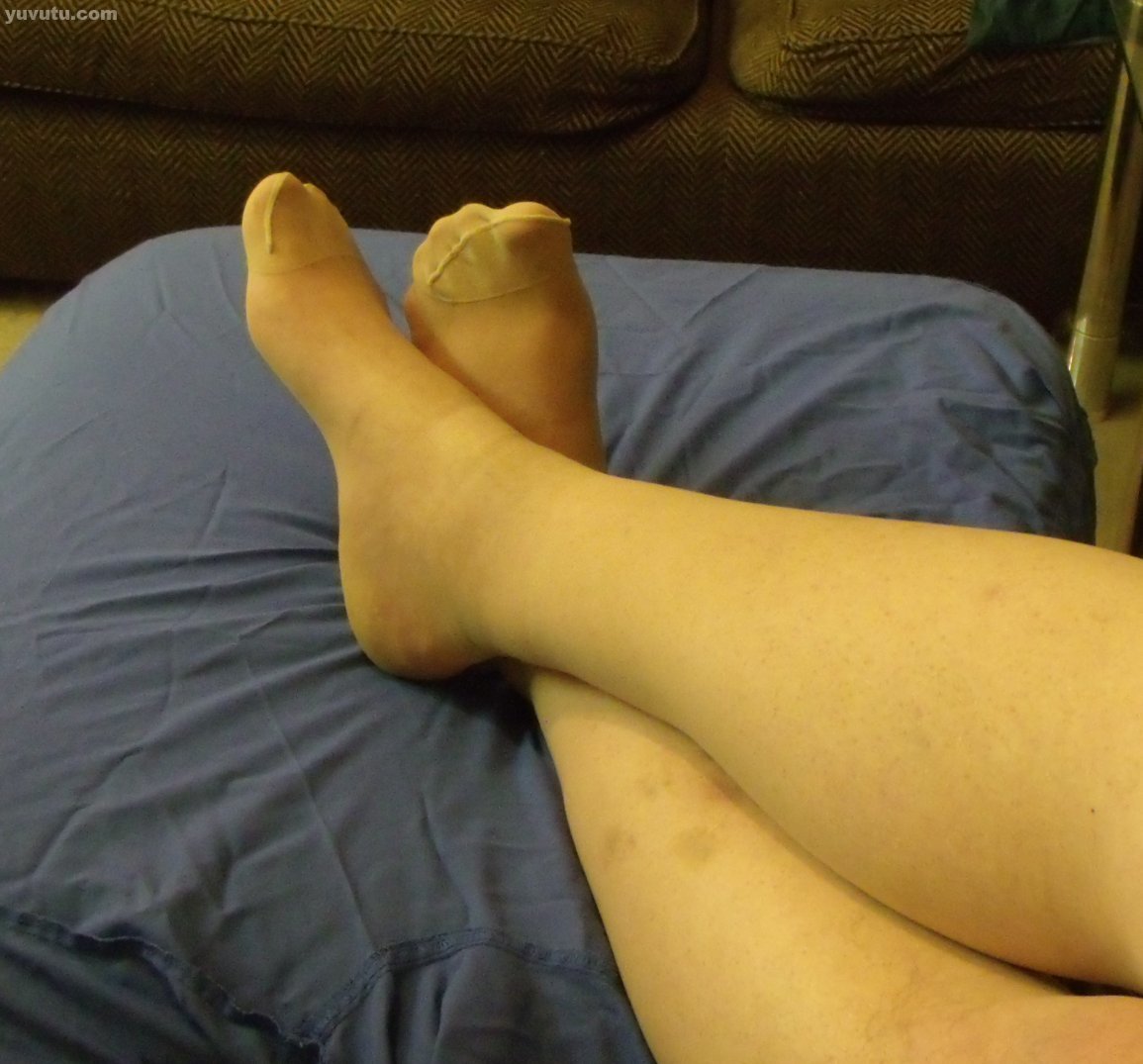 male in tights giving dildo a foot job...