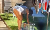 Voyeur upskirt wife doing laundry in the garden