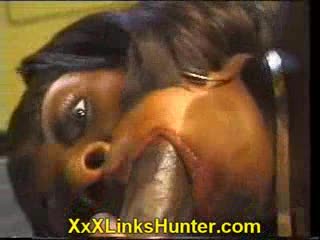 Amazona - Busty black girl eating an enormous cock