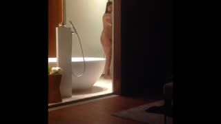  - Hot woman in the shower . She has amazing body .
